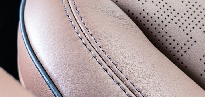 Retrimmed leather seat with new stitching