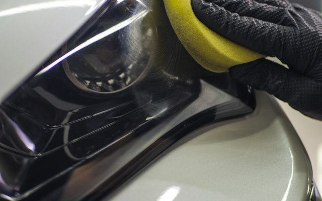 Machine polisher correcting dark blue paint